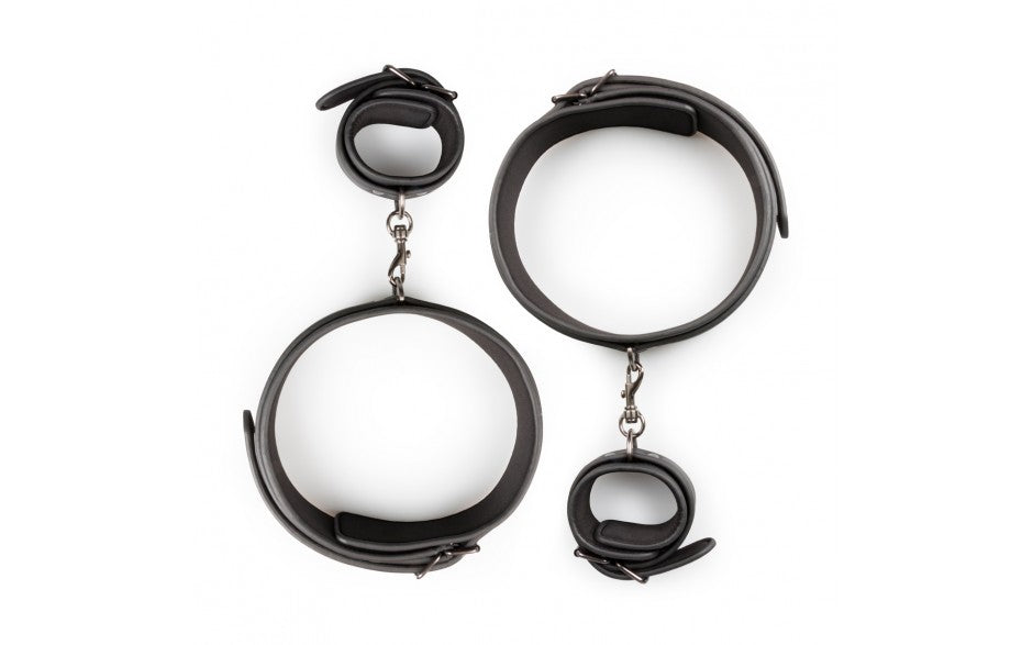 Easy Toys Fetish Collection | Thigh and Wrist Cuff Set With this special thigh and wrist cuff set, you can tie your sub's hands to his or her thighs. This way you have complete control for an enjoyable BDSM experience. The cuffs are made of strong and durable faux leather and are lined with foam to prevent scratching.