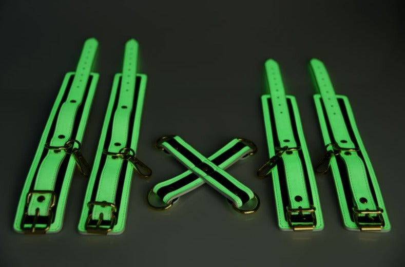 SHOP Master Series | Kink In the Dark Glowing Hog Tie Set - Fluro Green A Glowing Bondage Kit For Playing in the Dark!&nbsp;Add a kinky glow to your bedroom. This Glowing Hog Tie Set makes it easy to tie your lovers limbs behind their back so you can enjoy their body to your hearts content. The White Eco Leather and Gold hardware add an elegant touch!The cuffs adjust to fit, and come included with D-Rings