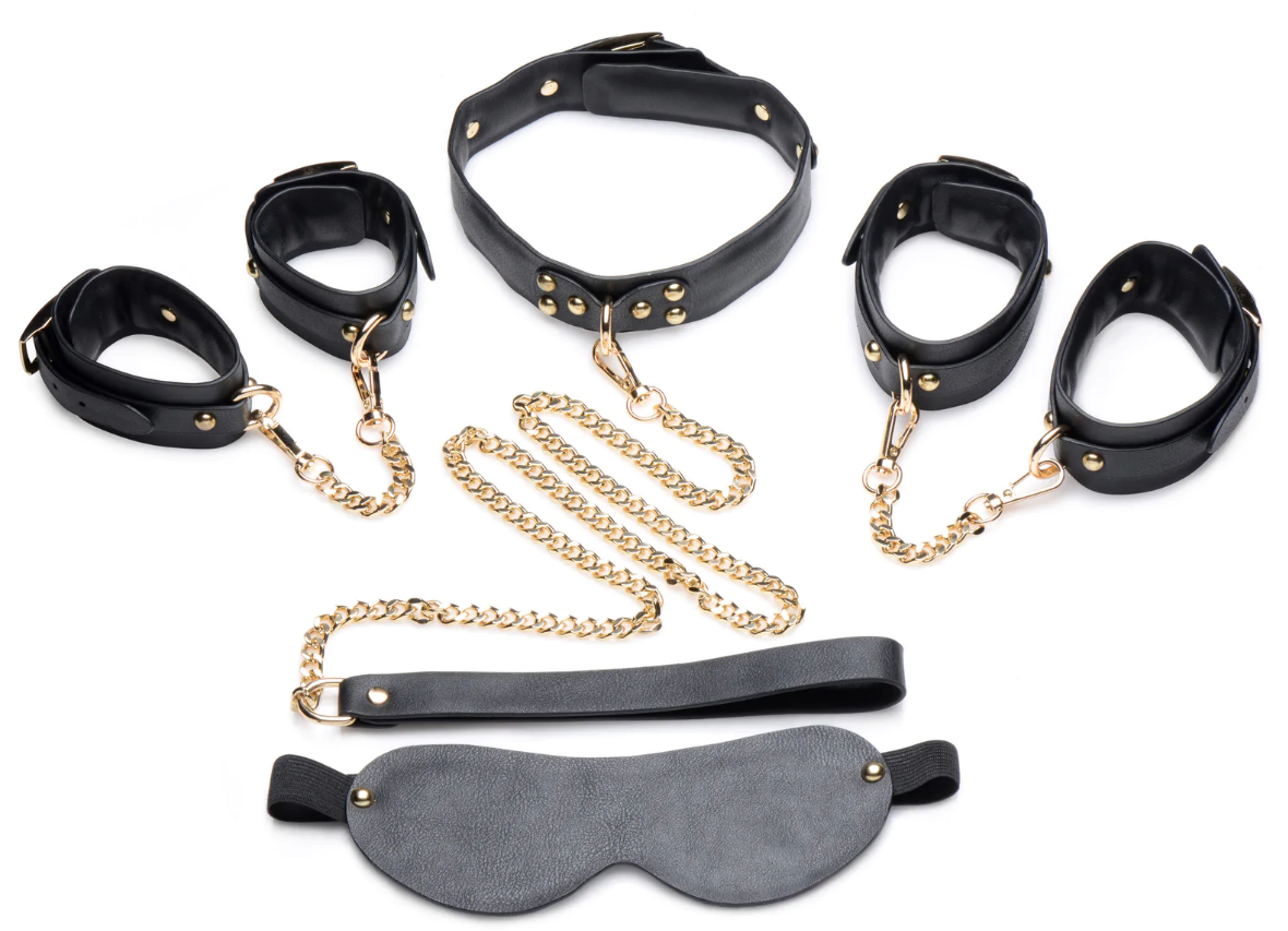 SHOP Master Series | Golden Submission Bondage - 5 Piece Set Submit and dominate in style with this regal kit of chains and cuffs! This Golden Submission kit is designed to glam up your dungeon with its golden chains, golden hardware, and sultry black leather cuffs and blindfold. Perfect for BDSM players with a penchant for the finer things in life, 