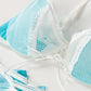 -  Beautiful Blue Adjustable Underwire Bra that leads into a soft white Lace cup. With Ribbon Lace up front adorned with a Floral Lace Edging. Multistage closure for a great fit. - Pantie with Detachable Garter Straps – ready to adjust, with a Lace Floral Trim that matches the Bra. Lace up front and a beautiful blue satin bow. - Nurses Cap with Blue Logo. - Beautiful Detailing on all Pieces.  