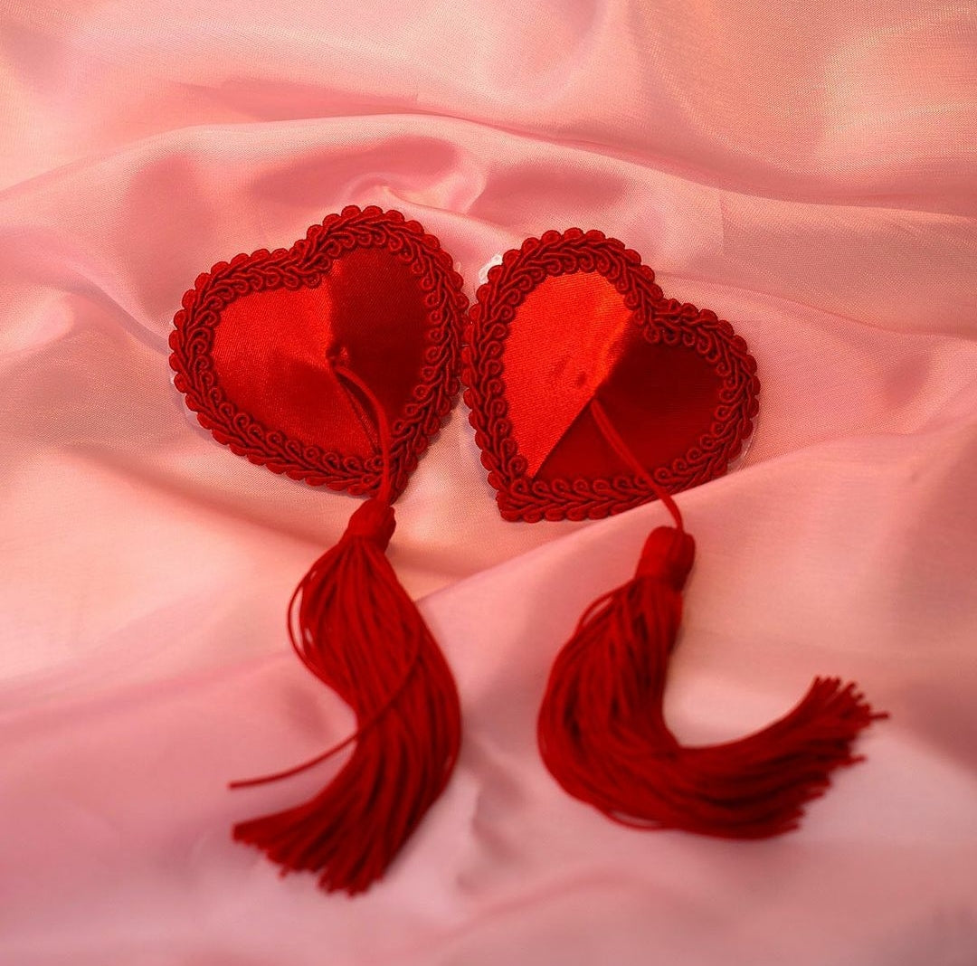 BUY Love Toy | Reusable Red Heart Tassels Nipple Pasties Struck by Cupid? These Divine Red Satin Heart Nipple Pasties, with Intimate Piping and Quality Soft Silky Tassels are the perfect length for putting on a Show, or Floating around like the love struck Angel you are.&nbsp; With Hypo-allergenic Self Adhesive that can&nbsp;be worn for 8+ hours. 