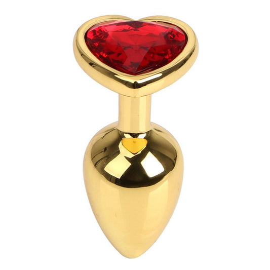 Metal | Gold Metal Anal Plug with Red Ruby Heart Crystal Small Enhance your booty play with this deluxe metal anal plug featuring a tapered tip for easy insertion and a red ruby heart crystal for added sparkle. Crafted from gold metal, the small size plug offers gentle pressure and extended wear. Temperature Play Babe? 