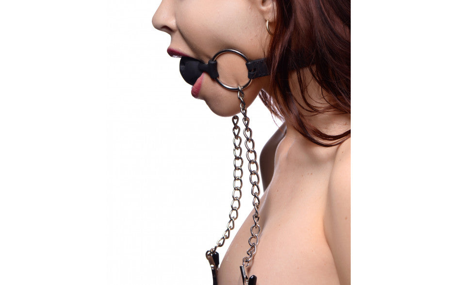 Master Series | Hinder Breathable Silicone Ball Gag With Nipple Clamps This breathable ball gag allows you to restrict the speech of your plaything, while still allowing them to breathe easily. The smooth silicone ball is tasteless and odorless, and large enough to gag them completely yet comfortably. The adjustable strap is made from soft, pliable silicone, and closes with a standard rolling buckle. 